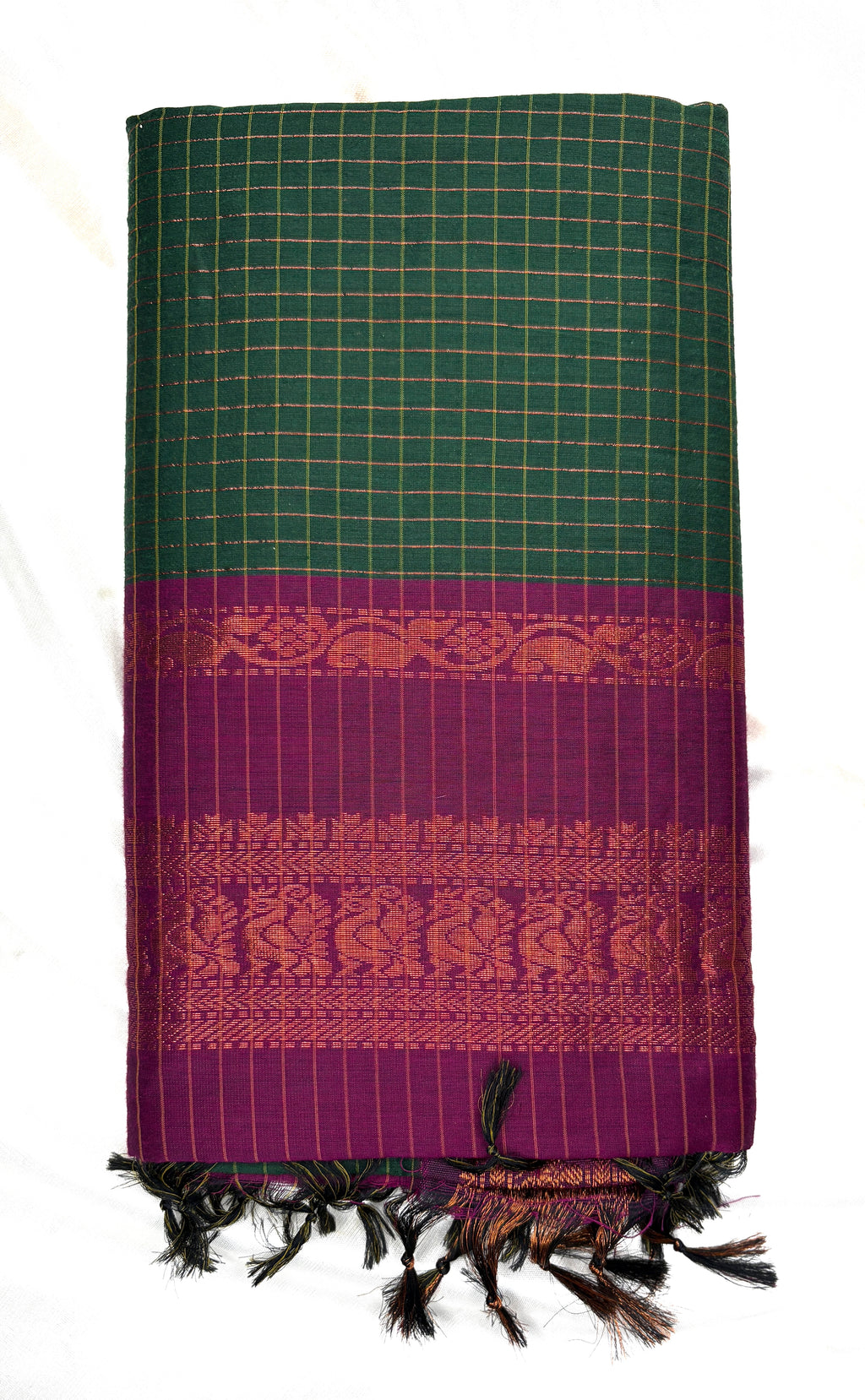 Green and purple patterned fabric with fringes on a white background