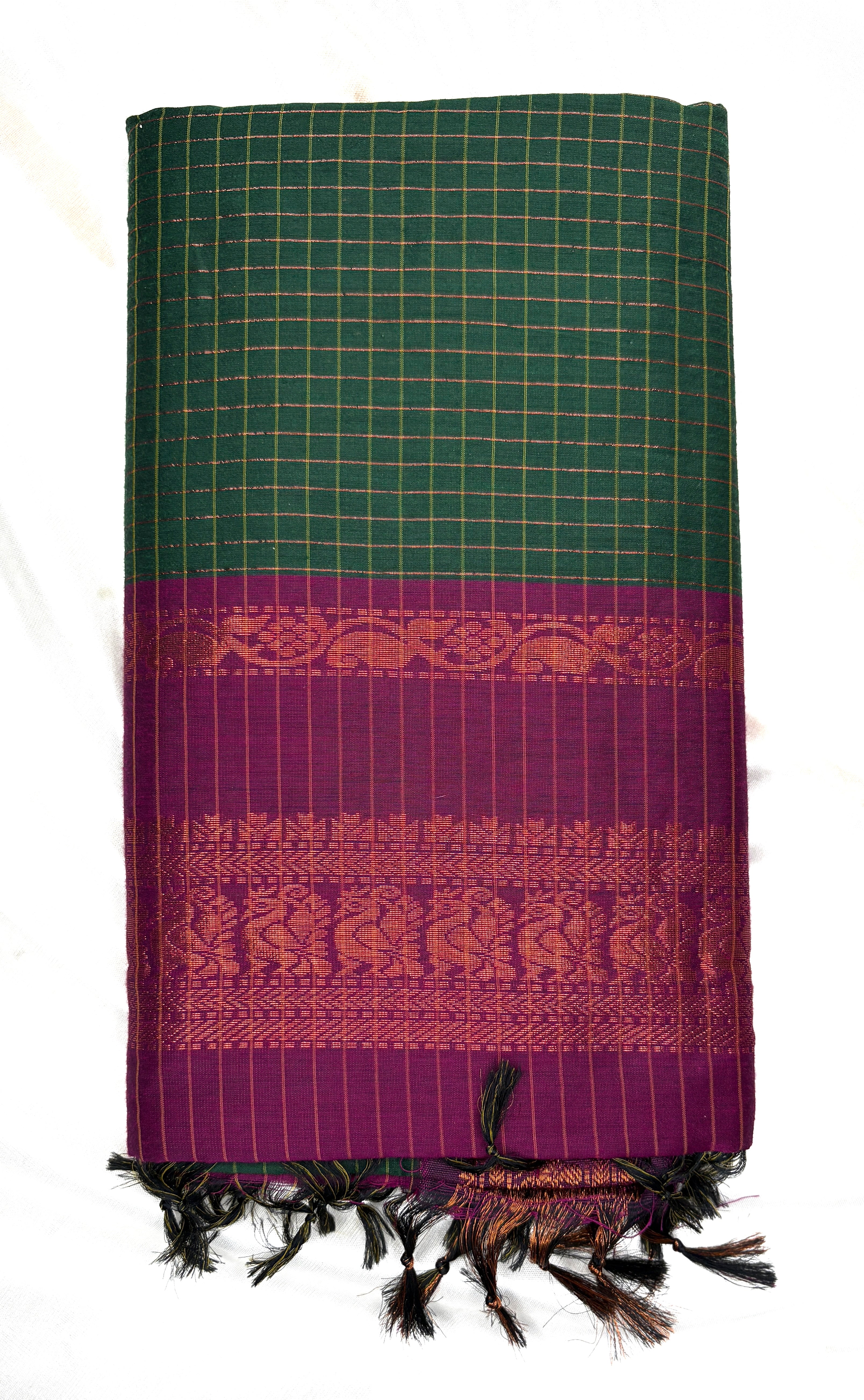 Green and purple patterned fabric with fringes on a white background