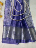 Purple saree with silver border and pearl border on a white background