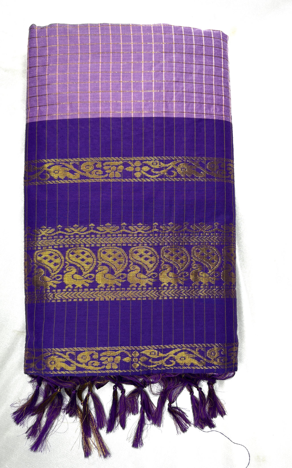 lanveder fabric with gold patterns and tassels on a white background