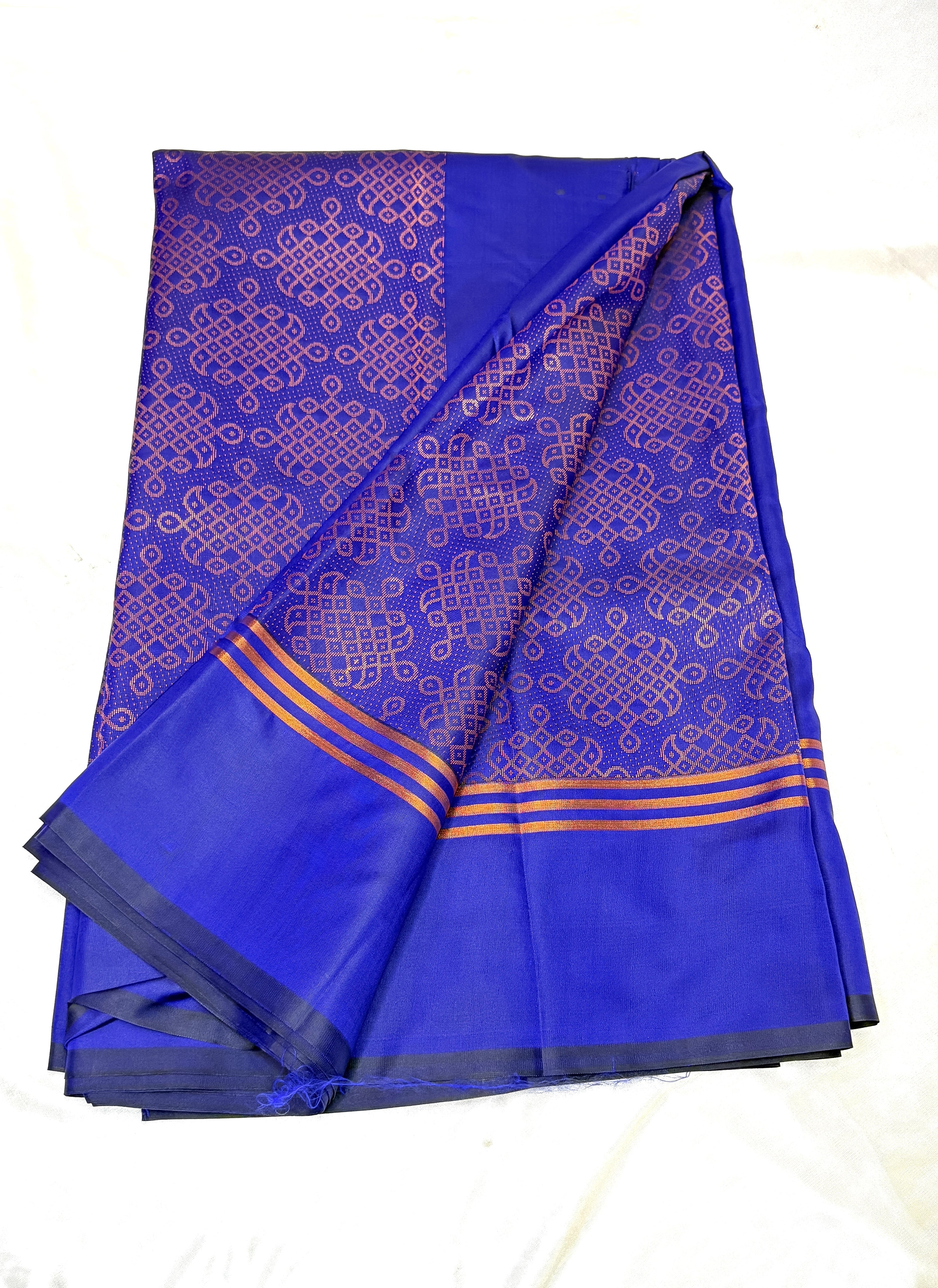  Blue saree with kolam patterns on a white background