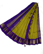 Green and purple saree with gold border on a white background