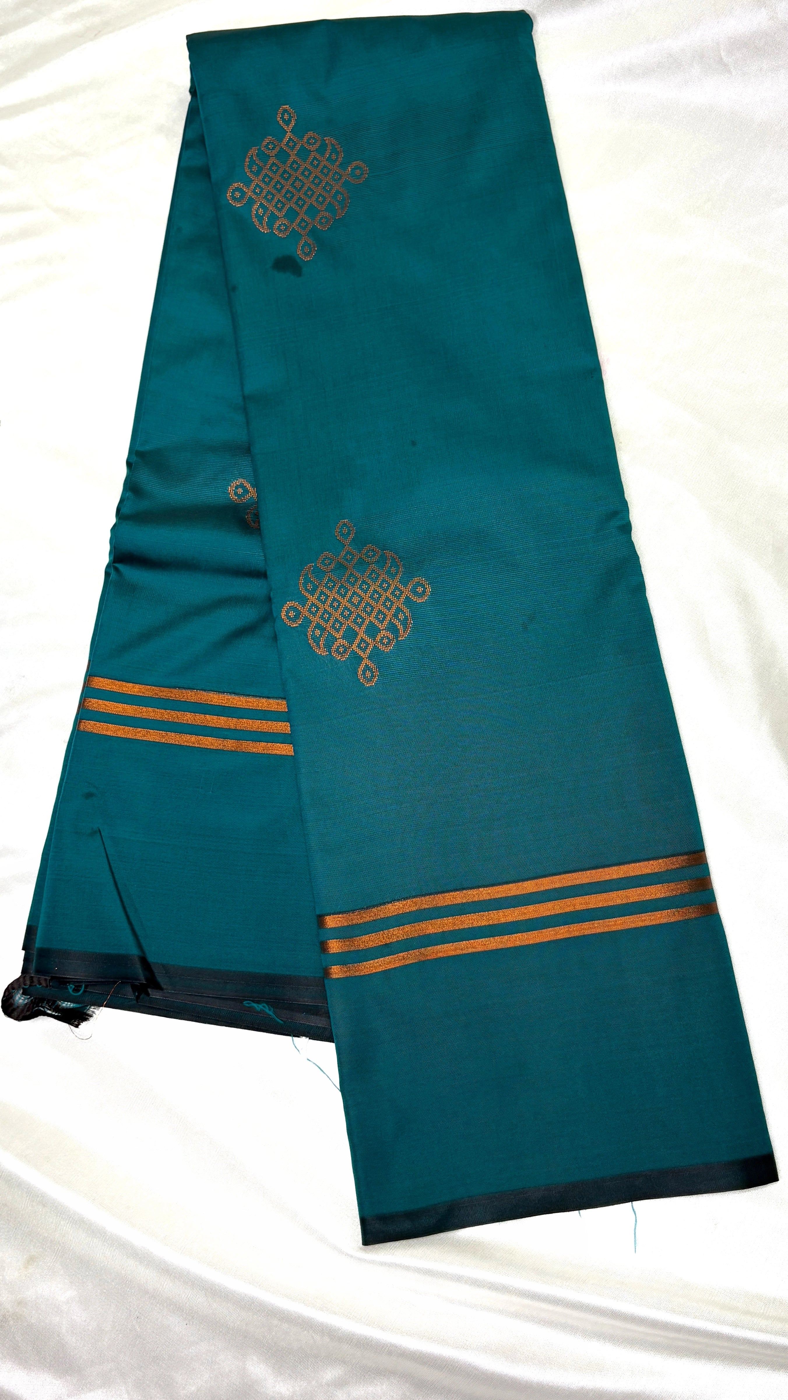 Teal green soft silk saree with traditional kolam zari motifs and zari border South Indian silk saree for weddings and festive wear
