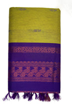 Purple and green fabric with intricate patterns on a white background