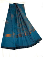 Blue saree with intricate patterns on a white background