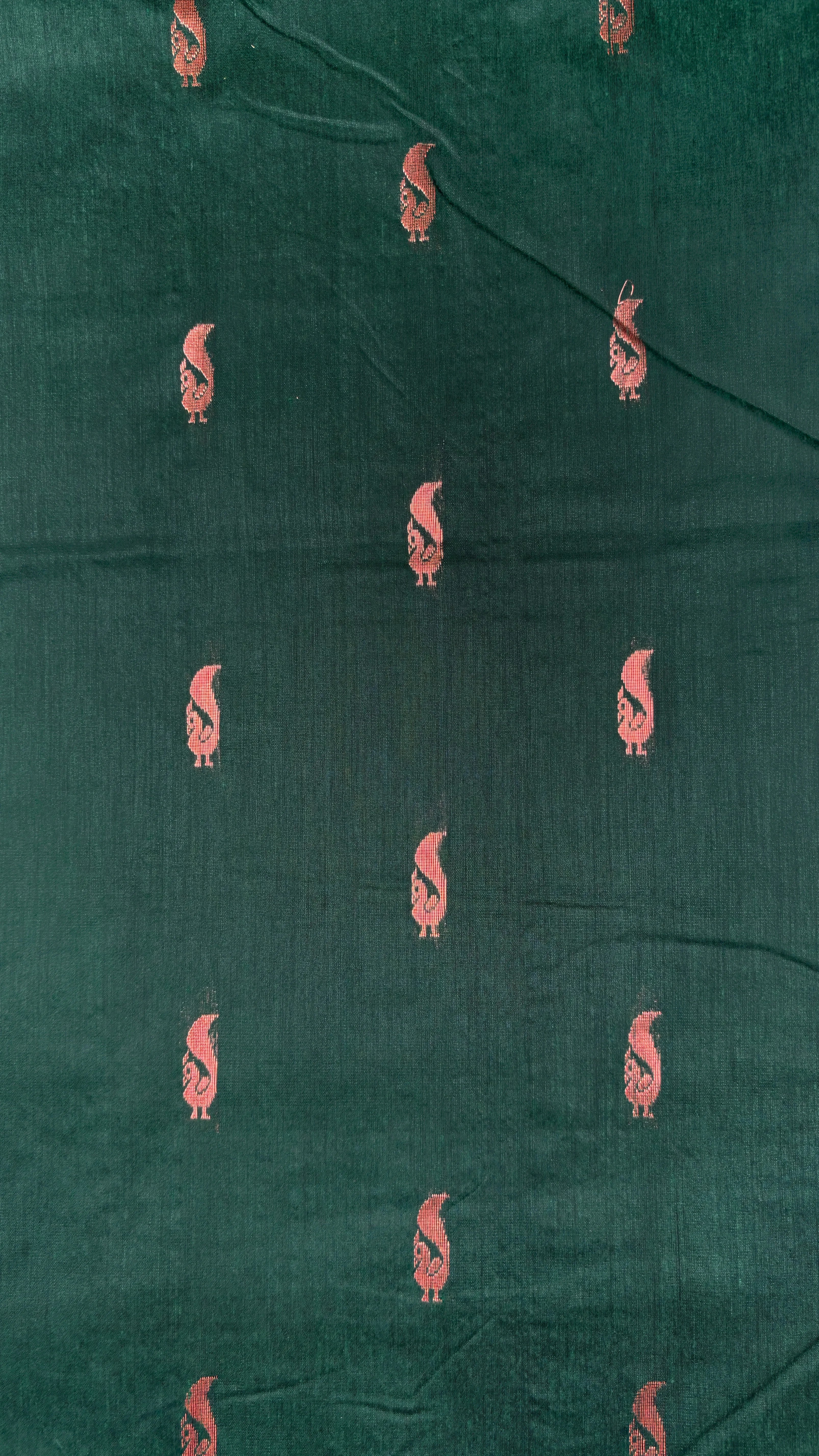 Green fabric with small peecock patterns