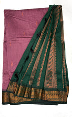 Green and pink saree with gold border on a white background
