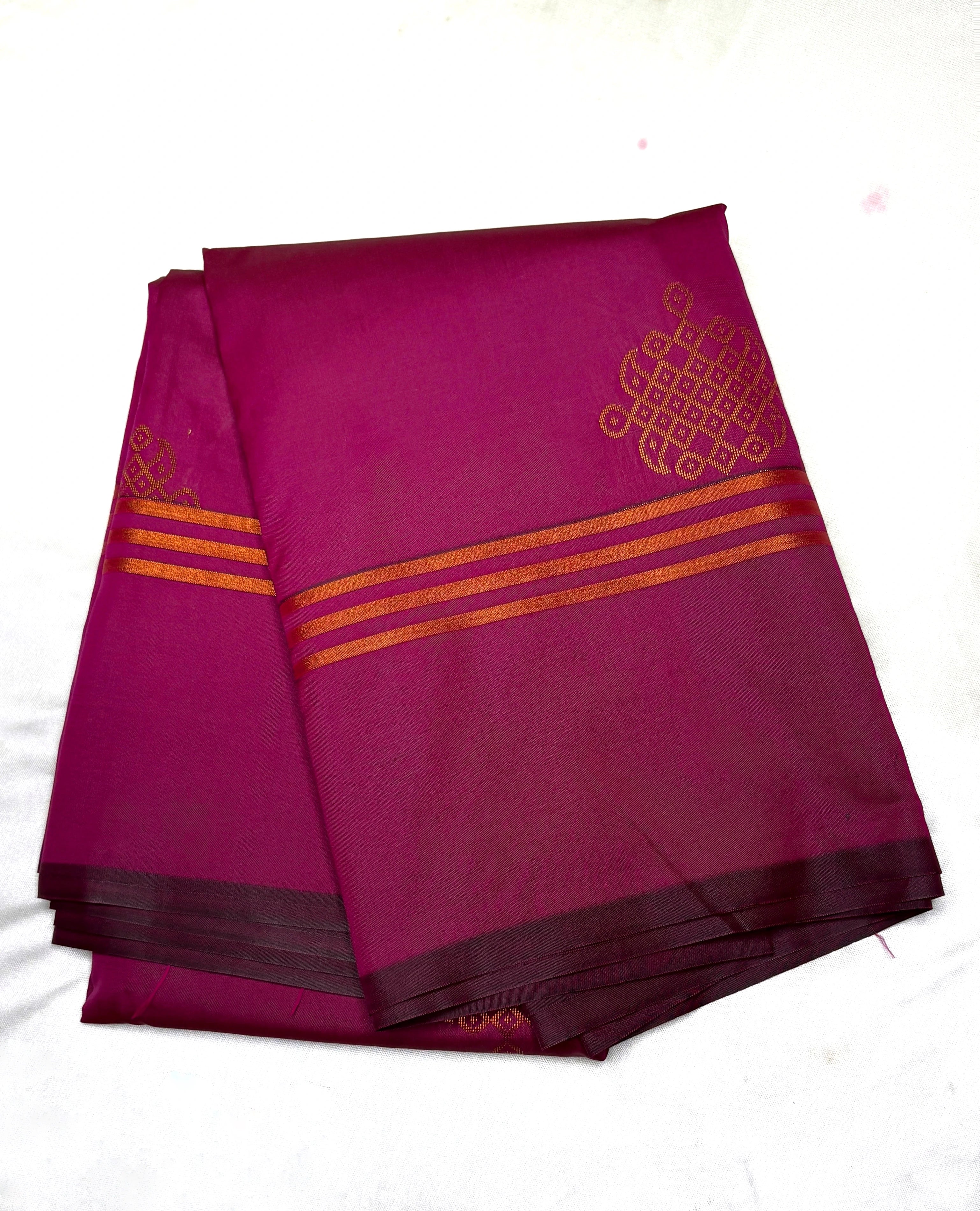 Purple fabric with gold patterns on a white background